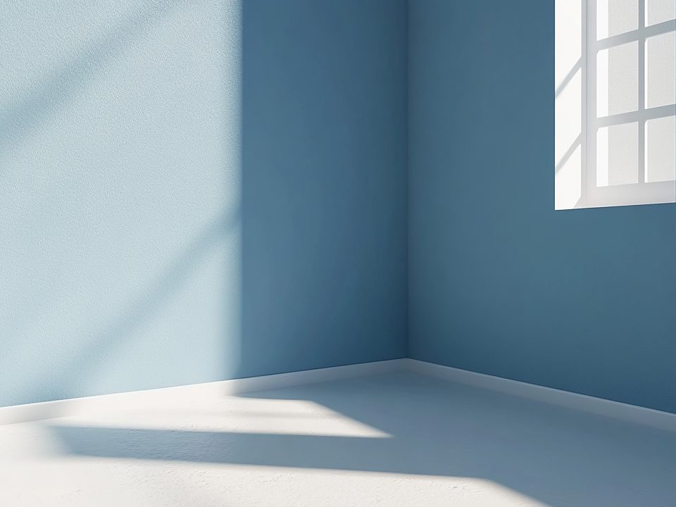 A blue room with beautifully repaired and painted corners. Corners repaired with paper tape.