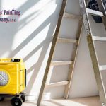 Ladder and yellow air scrubber equipment