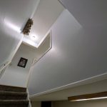 Before and after wallpaper removal and interior painting on a stairwell in Rochester, Indiana